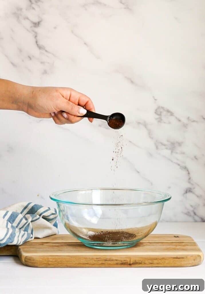 Velvet Dalgona Latte 5 Instant coffee, sugar, and hot water in a bowl.