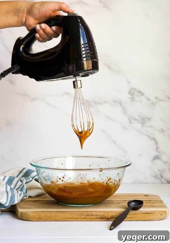 Velvet Dalgona Latte 9 Spoonful of Dalgona coffee mixture.
