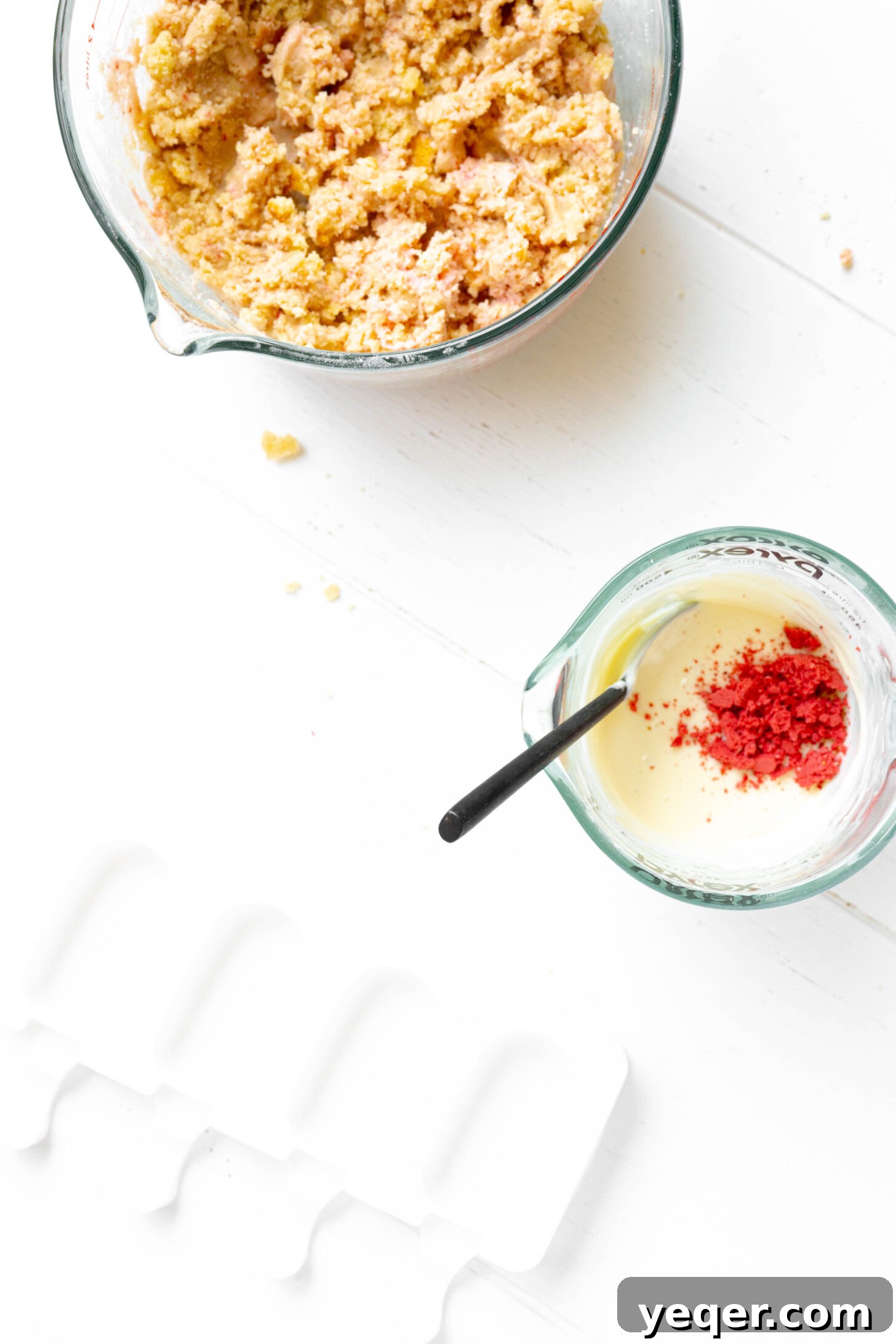 Whimsical Pink Pops 4 Freeze dried strawberries pulverized in a bowl with melted white chocolate.