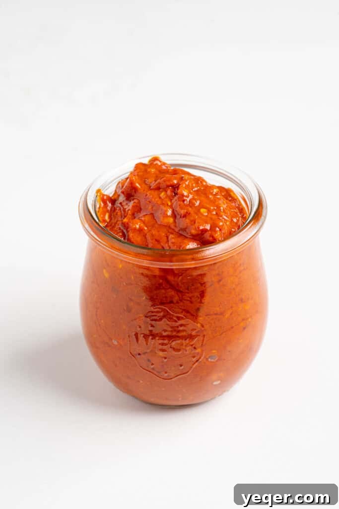 Unlocking Moroccan Flavor with Homemade Harissa 7 A sealed jar of freshly made homemade harissa, ready for storage.