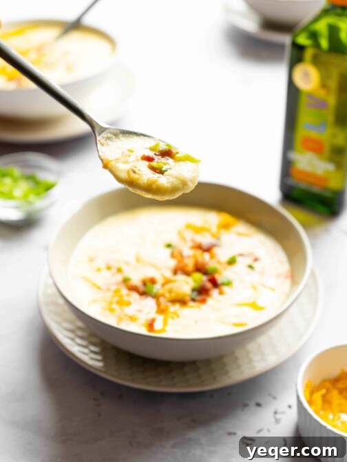 A spoon full of cauliflower soup.