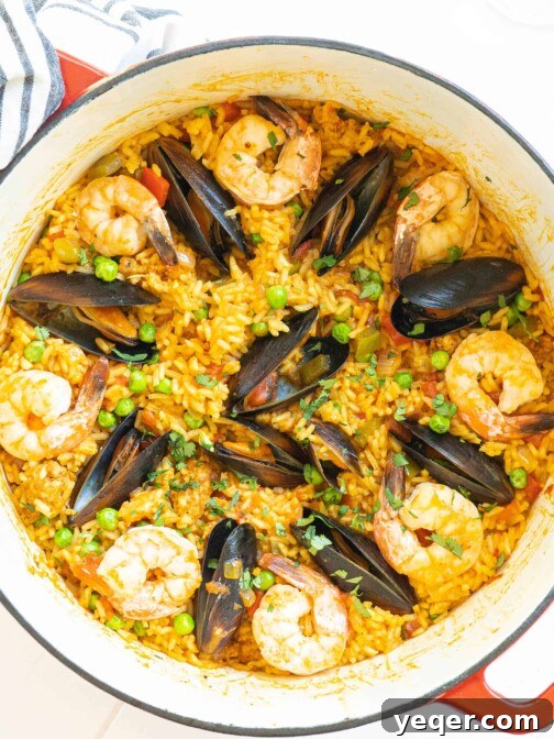 A pot full of seafood paella.