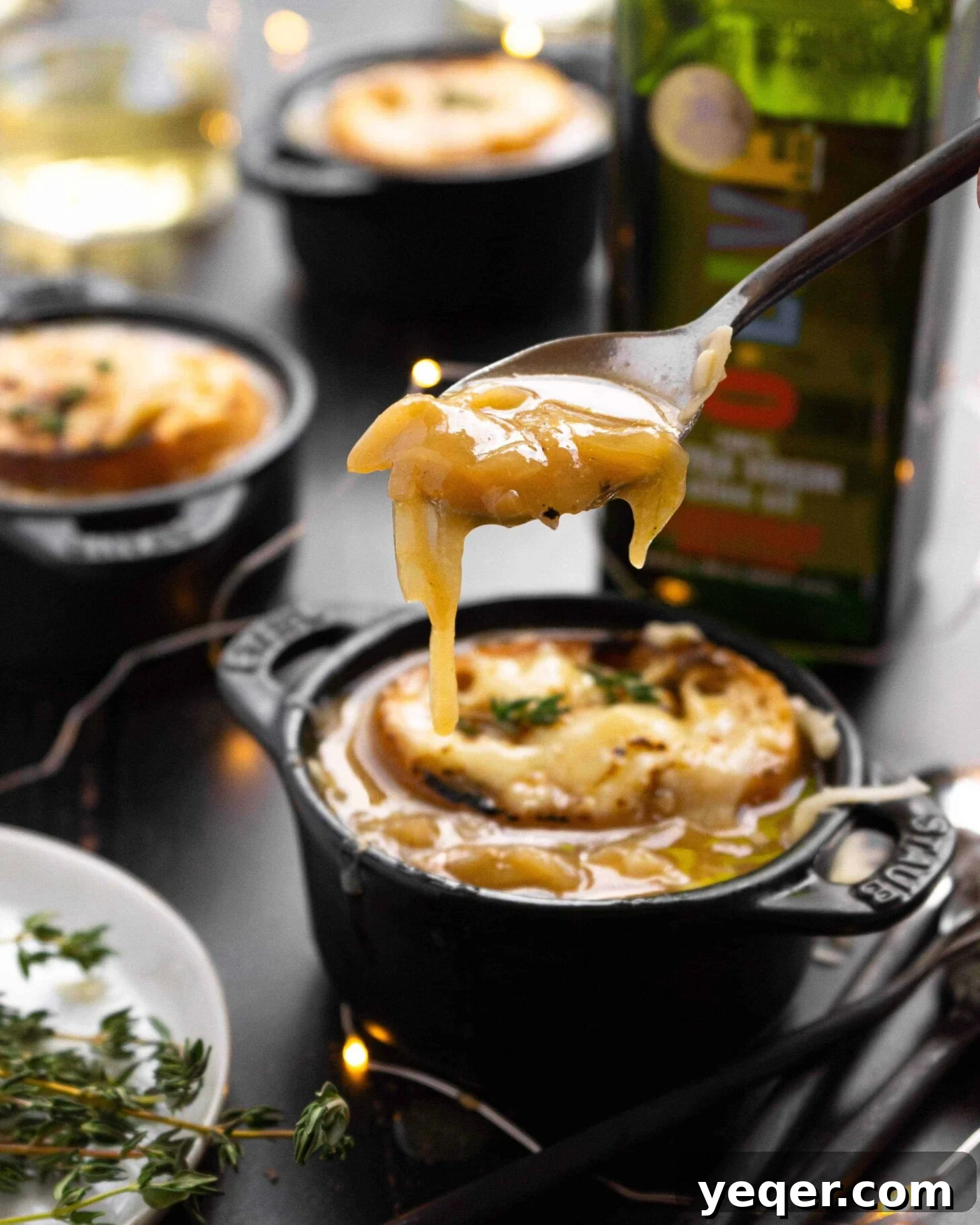 Homemade French Onion Soup Elevated with O-Live and Co 7 A spoon scooping up some French Onion Soup