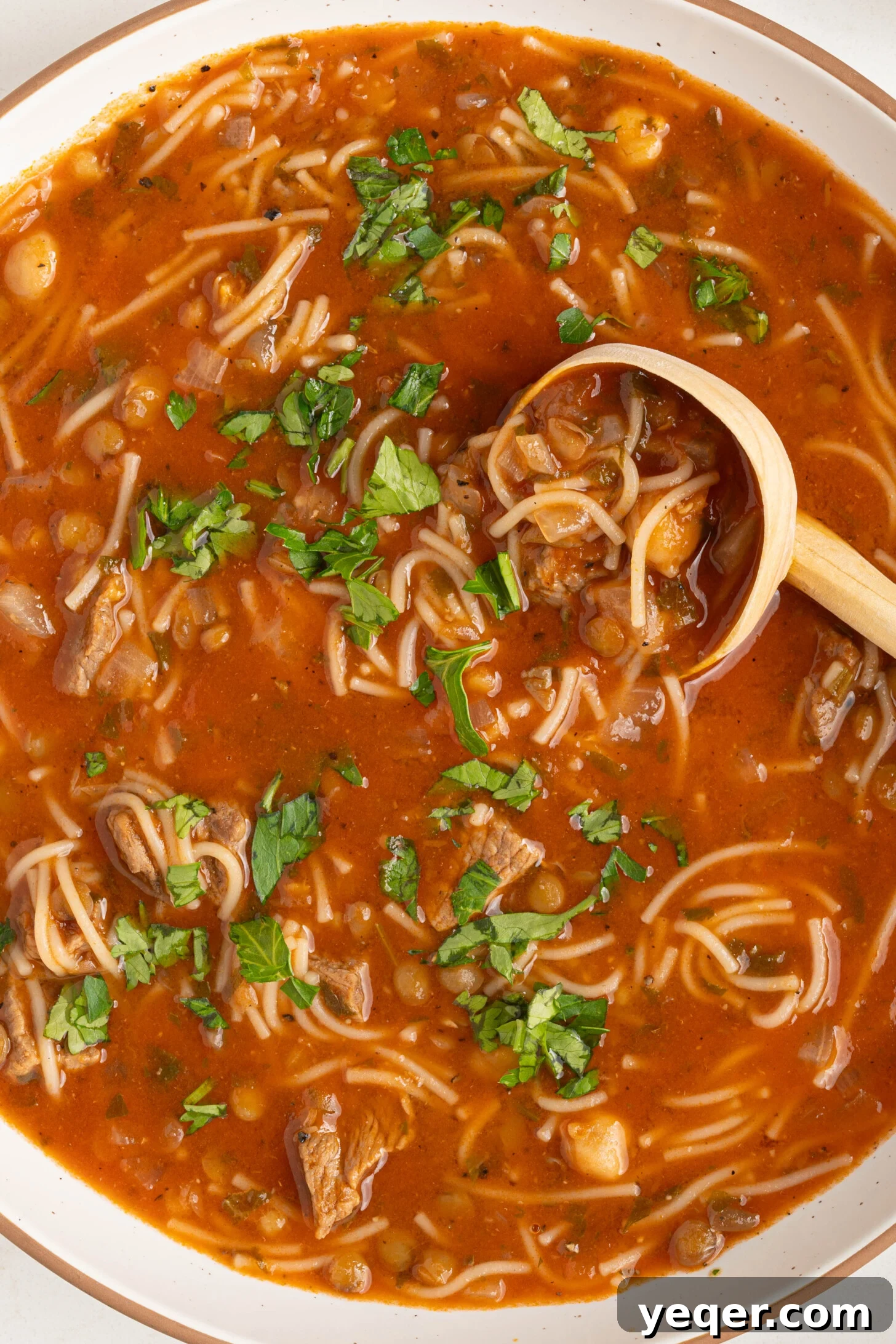 Moroccan Harira: A Spiced Lentil and Chickpea Comfort Soup 13 a bowl of Moroccan harira soup