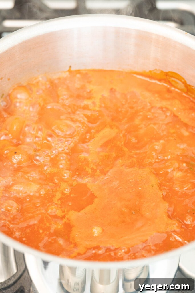 Moroccan Harira: A Spiced Lentil and Chickpea Comfort Soup 8 a pot of Moroccan harira boiling