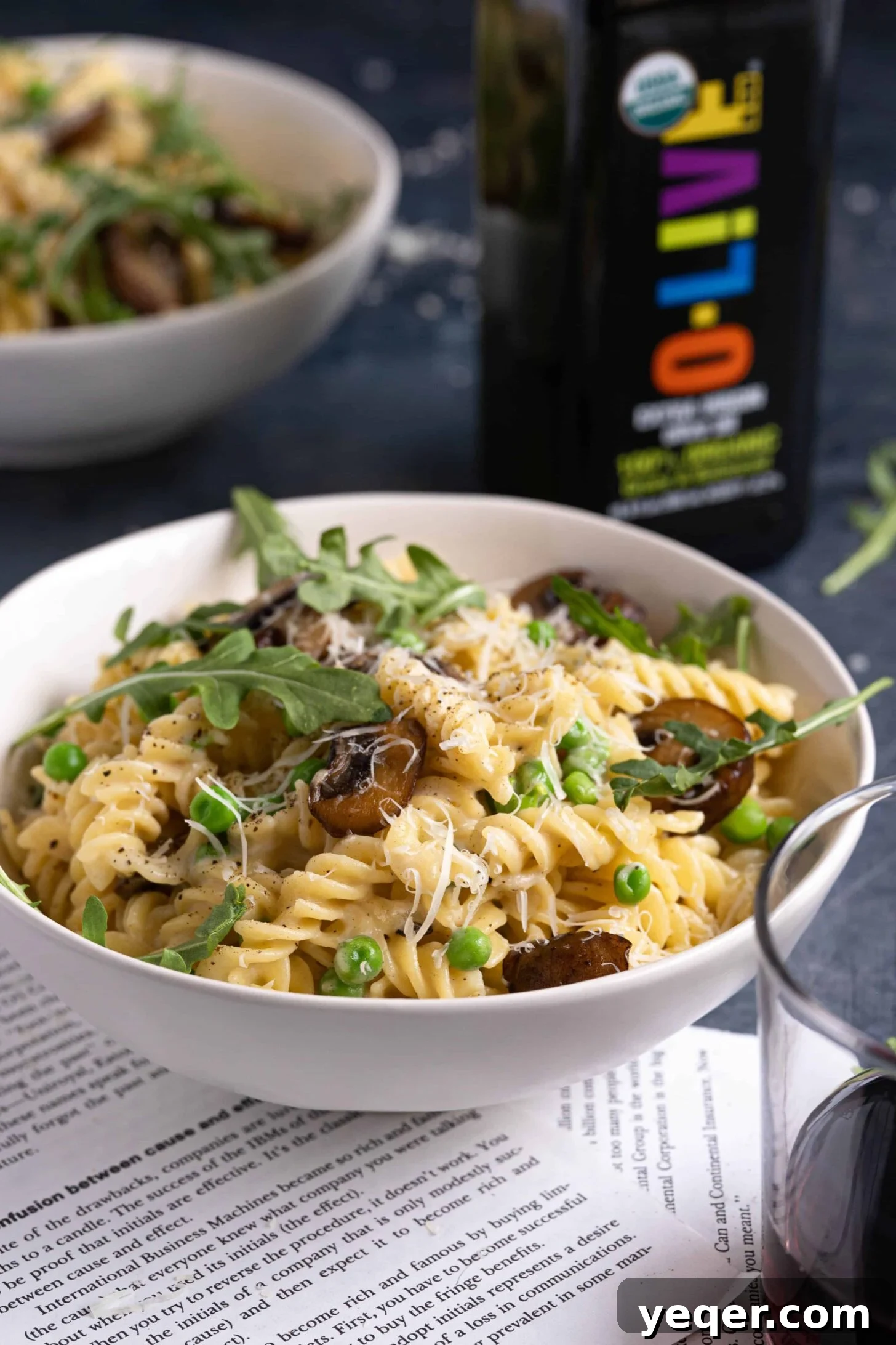 Savory Mushroom Medley Pasta 2 A bowl of creamy vegetarian mushroom pasta, garnished with fresh herbs and parmesan.