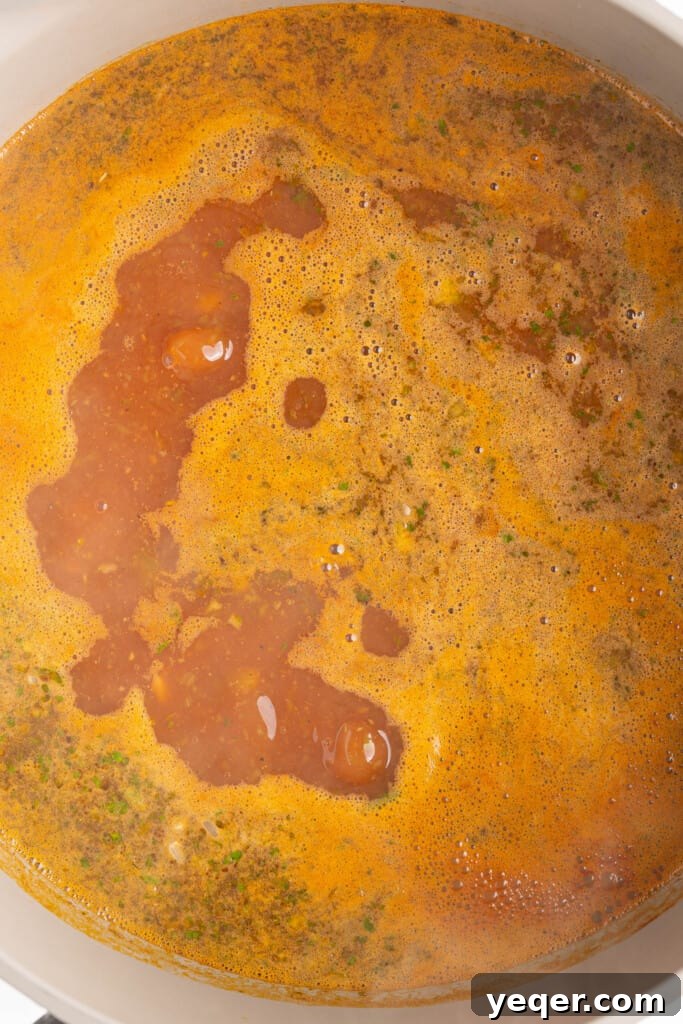 Puerto Rican Sofrito Rice and Pigeon Peas 6 boiling broth in a pot