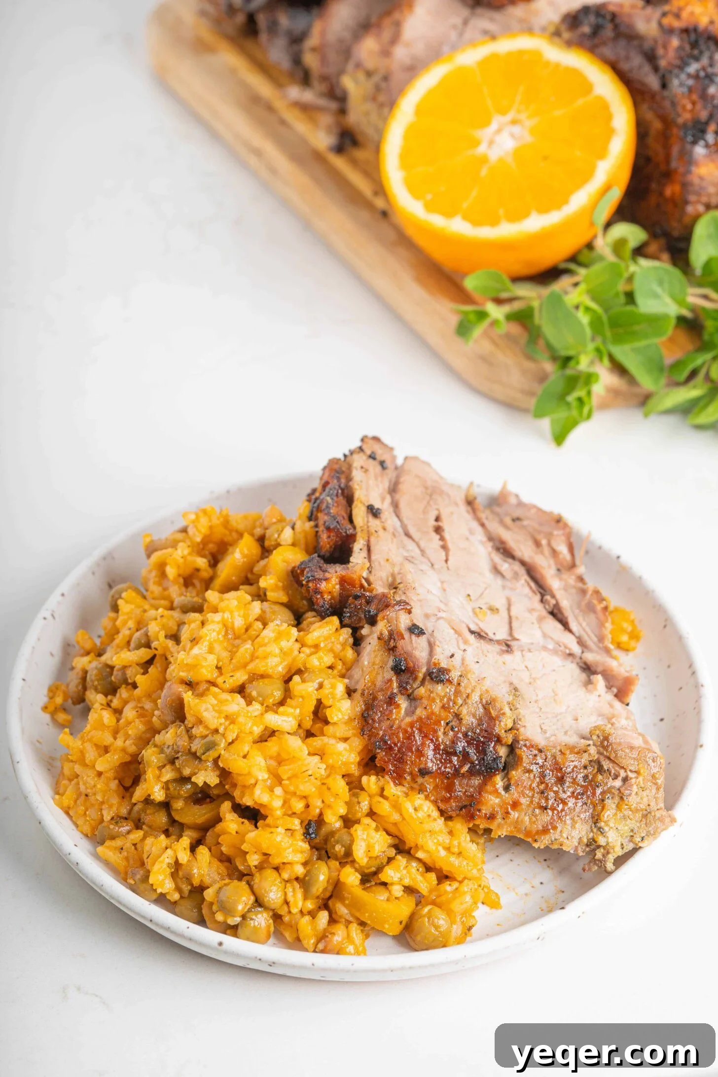 Puerto Rican Sofrito Rice and Pigeon Peas 8 pernil with arroz con gandules on a plate