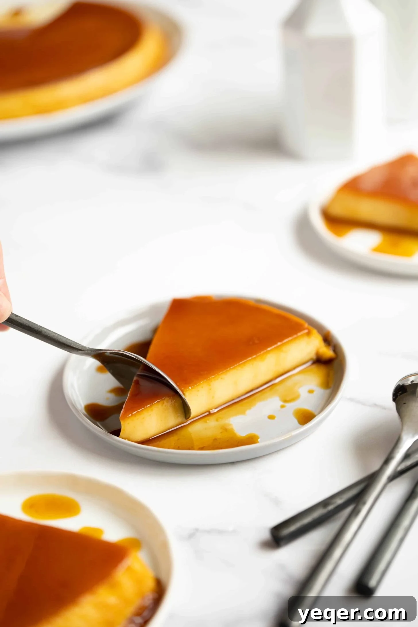 Silky Puerto Rican Caramel Flan 2 A plate with a slice of Puerto Rican flan, showcasing its creamy texture and rich caramel topping.