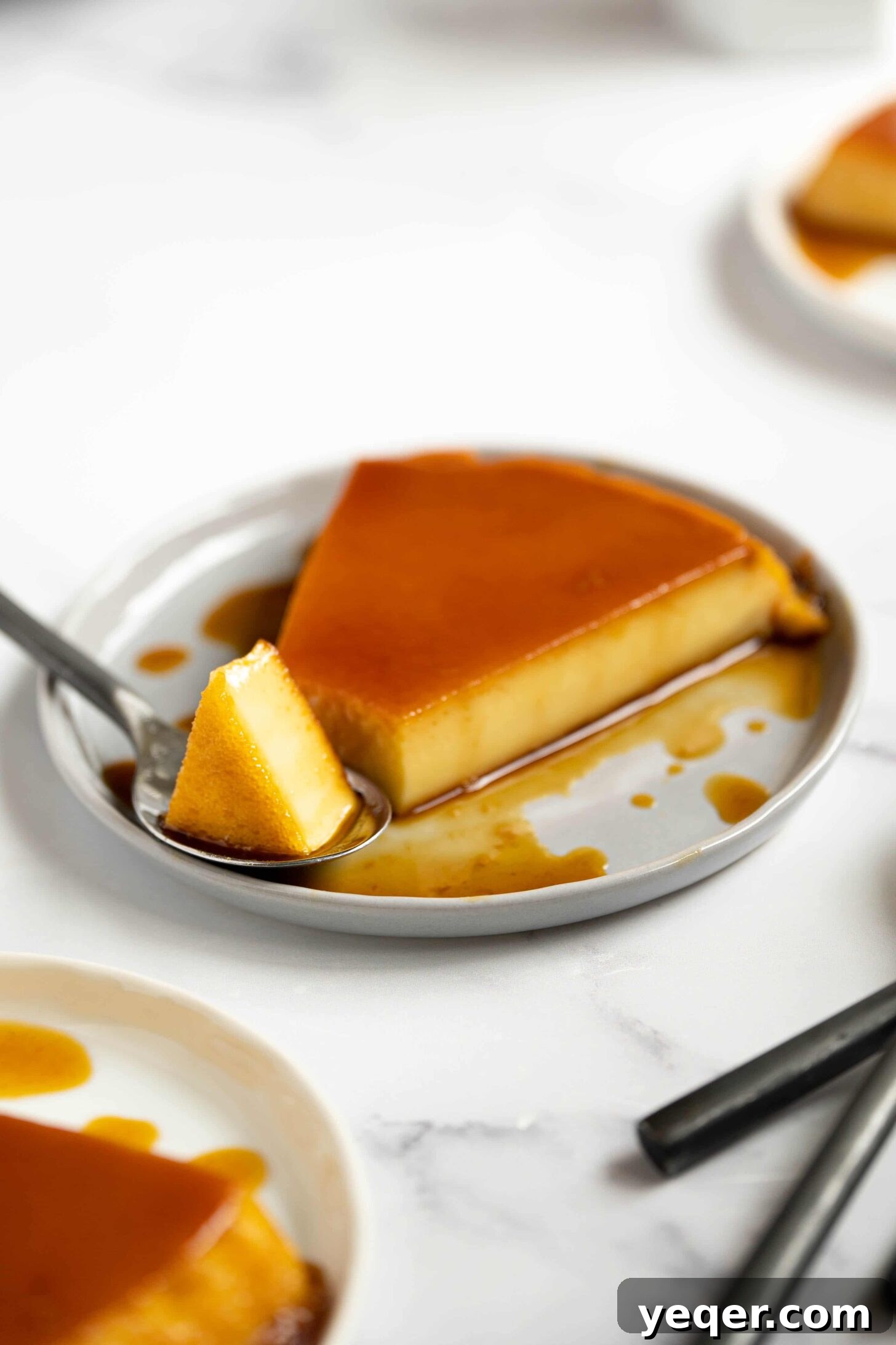 Silky Puerto Rican Caramel Flan 16 A beautifully presented plate with a slice of Puerto Rican flan, ready to be enjoyed.