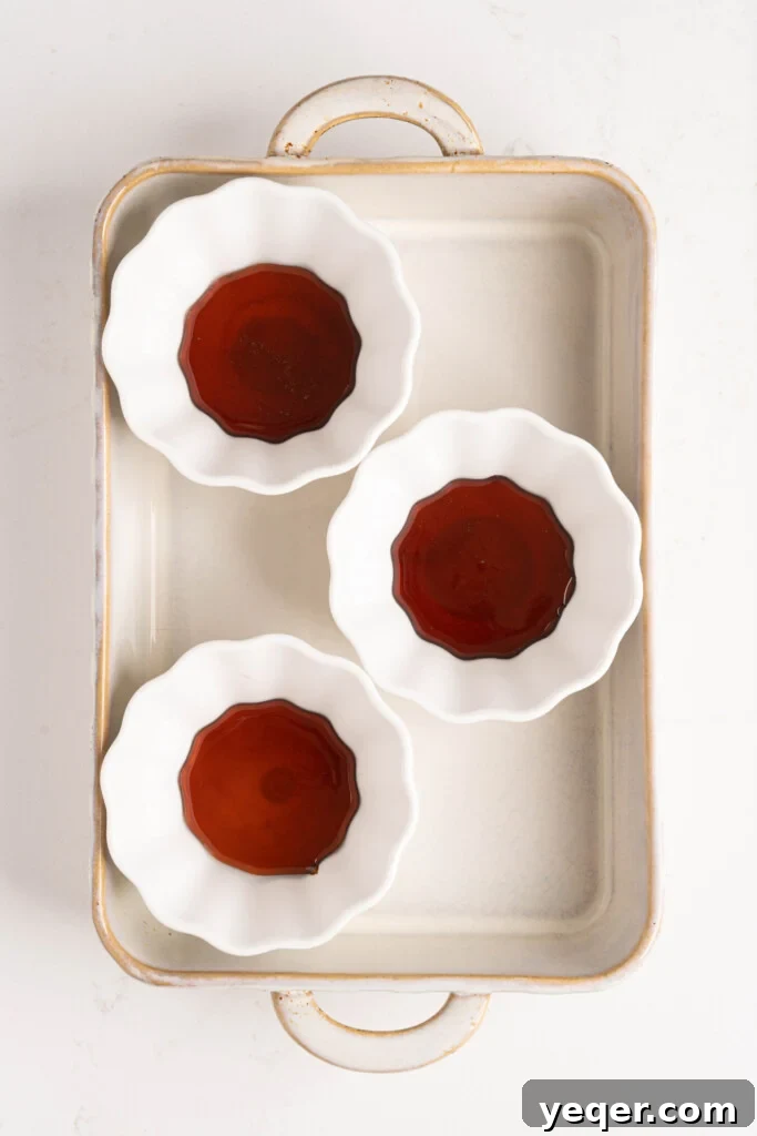 Silky Puerto Rican Caramel Flan 6 Warm caramel carefully swirled into small ramekins, coating the bottom and sides evenly.