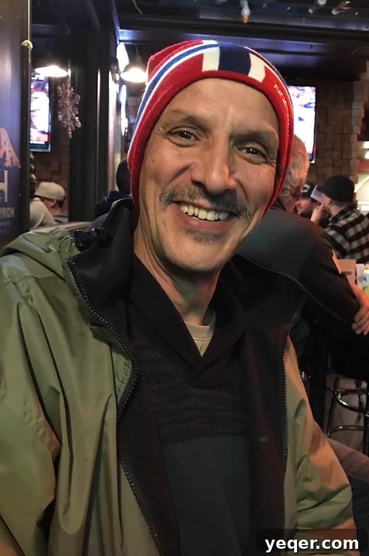 Moroccan Mint Elixir 10 A warm and inviting portrait of a smiling man, likely the author's father, embodying a spirit of contentment and simple pleasures.