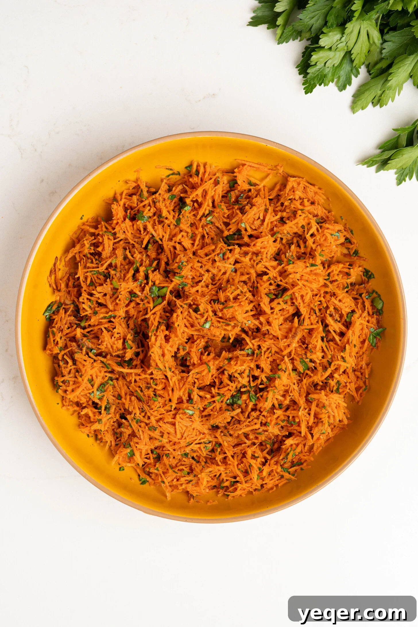 Zesty 10-Minute Moroccan Grated Carrot Salad 6 A beautifully presented bowl of Moroccan carrot salad.