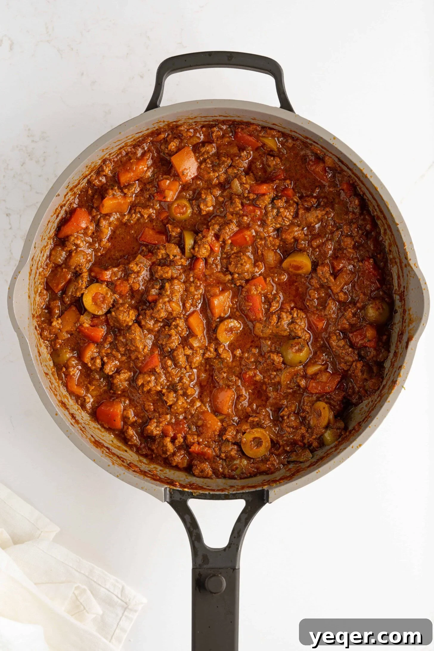 Savory Puerto Rican Fried Pockets 7 picadillo in a pan