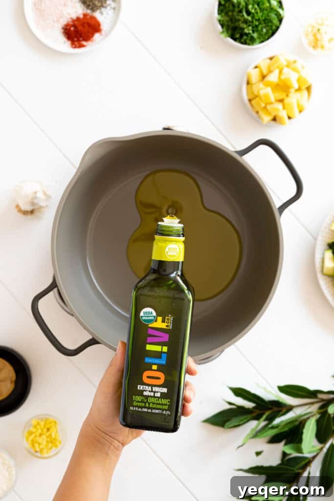 Moroccan Fish Tagine 4 Olive oil pouring into a pot