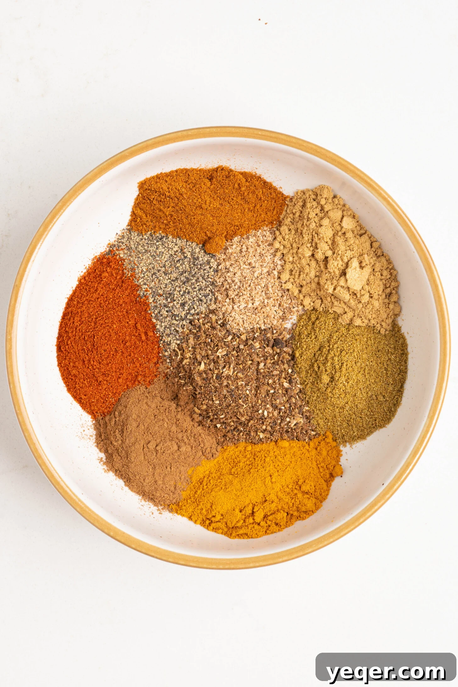 Homemade 5-Minute Ras El Hanout Spice Mix 3 Ras el hanout spices in a bowl.