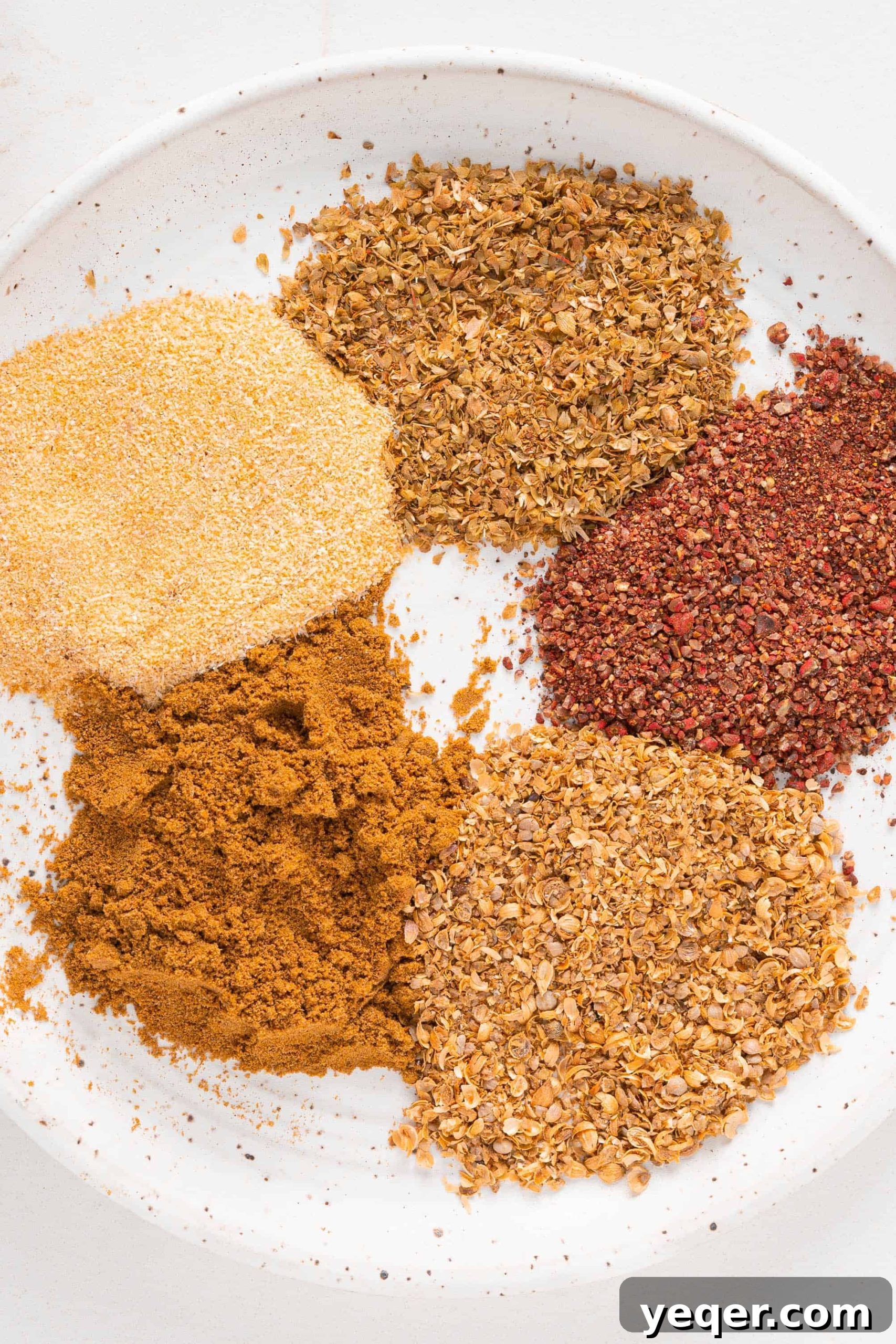 A Taste of Puerto Rico: Over 30 Authentic Island Classics 3 A bowl filled with a rich, reddish-orange sazon seasoning, ready to infuse authentic flavor into Puerto Rican dishes.