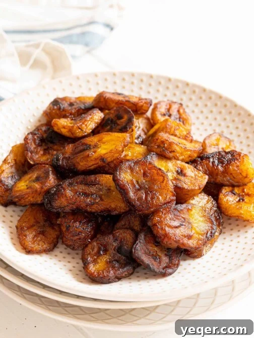 A plate of sweet fried plantains, Maduros, garnished with cinnamon.