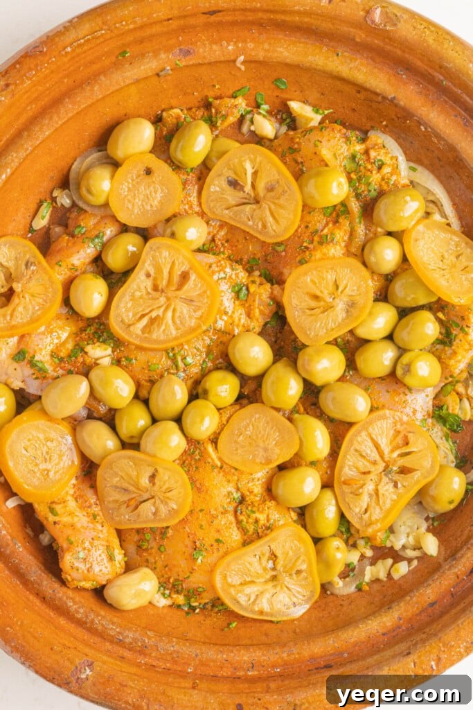 Mastering Moroccan Chicken Tagine at Home 7 a raw chicken tagine with olives and lemon