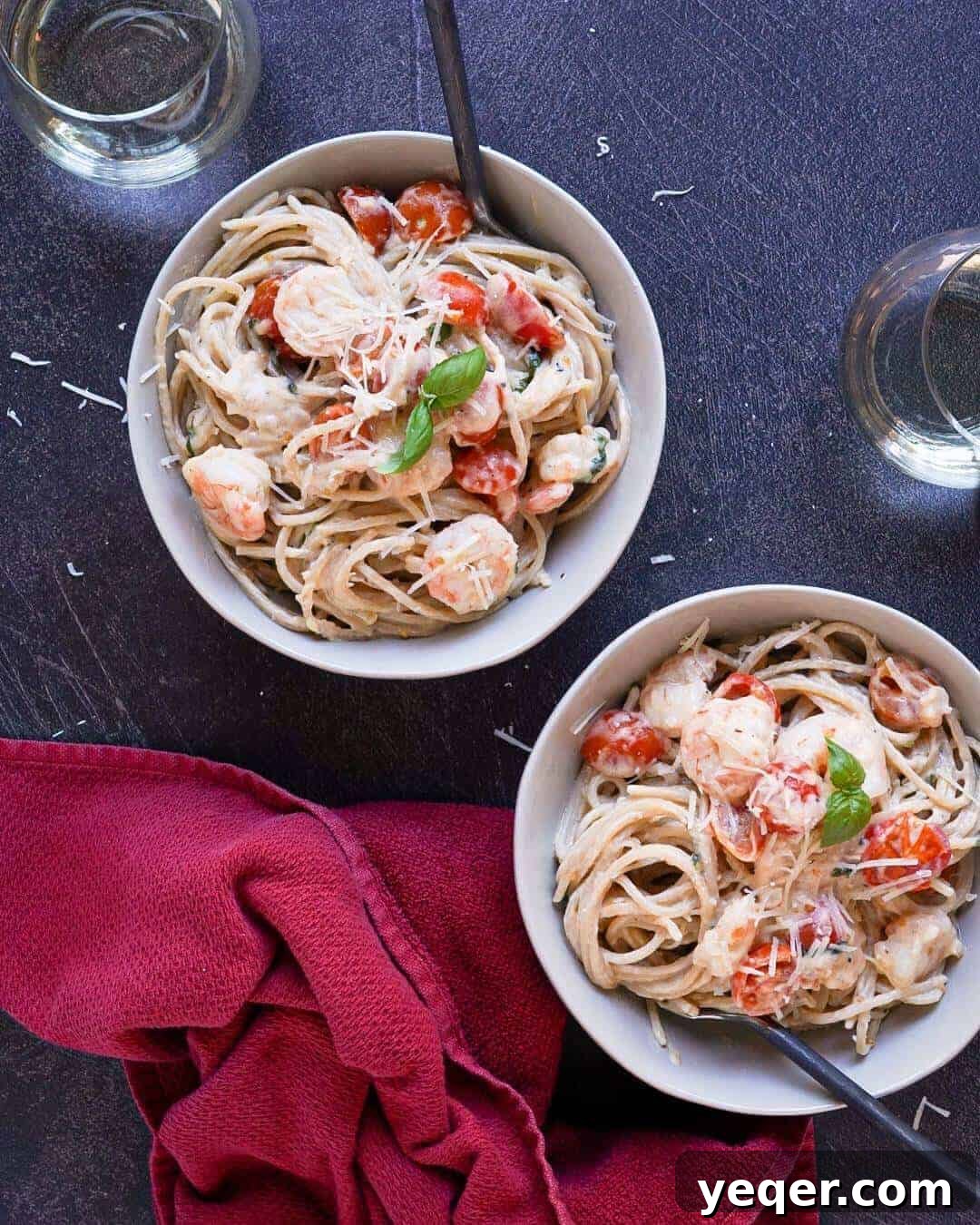 Velvety Shrimp Carbonara 2 Two bowls of gluten free shrimp carbonara, garnished with fresh basil and parmesan.