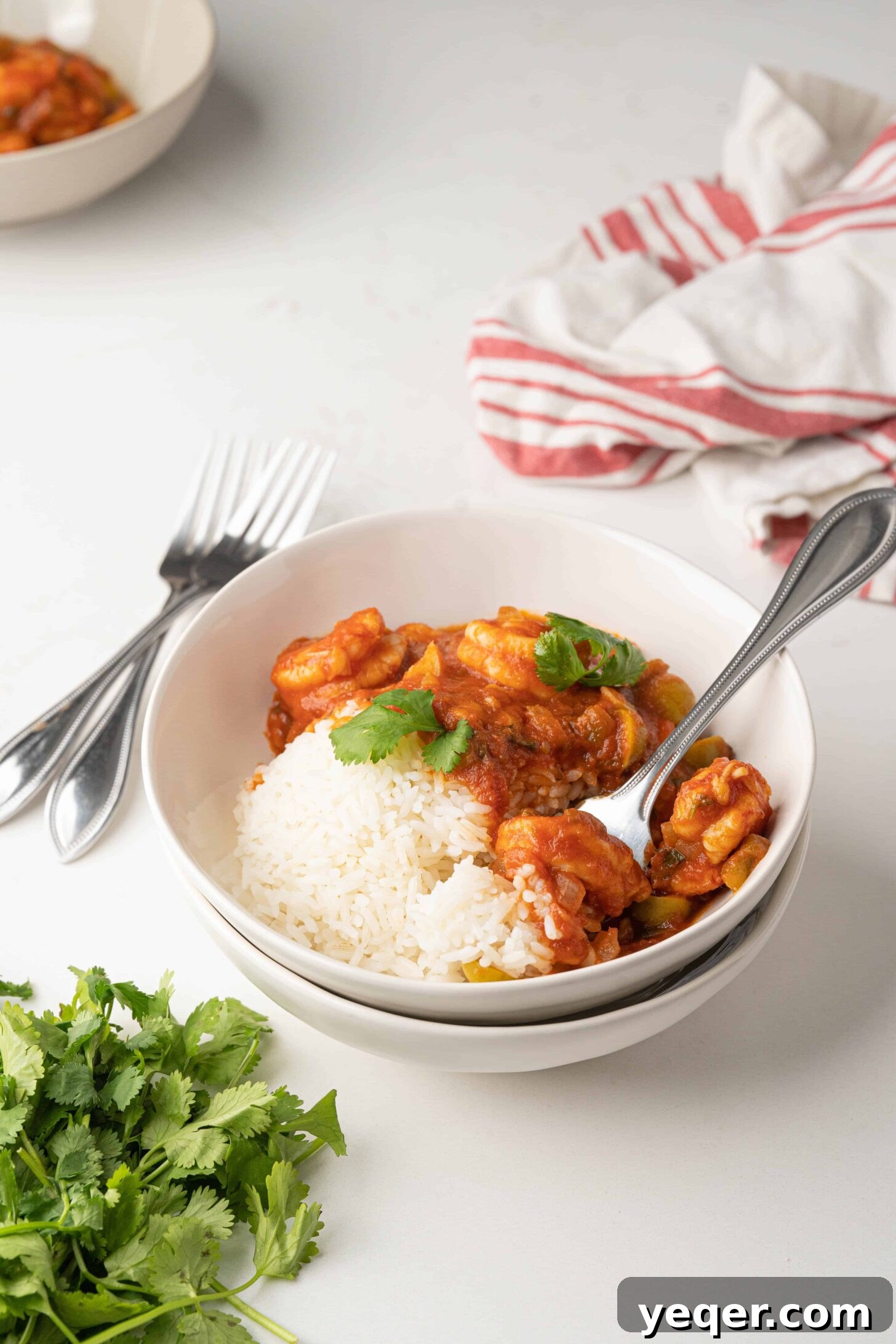 Savory Simmered Shrimp 2 A vibrant bowl of Camarones Guisados, stewed shrimp, garnished with fresh cilantro, ready to be served.
