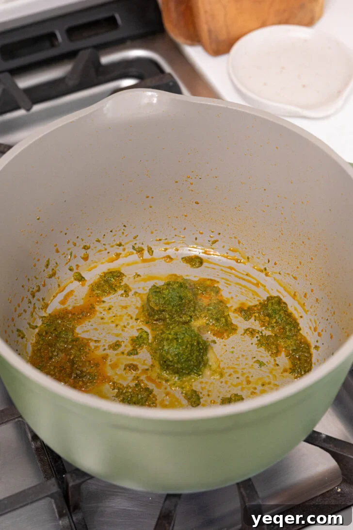 Hearty Puerto Rican Bean Stew 5 Olive oil shimmering in a large soup pot, ready for the vibrant sofrito to be added and sautéed.