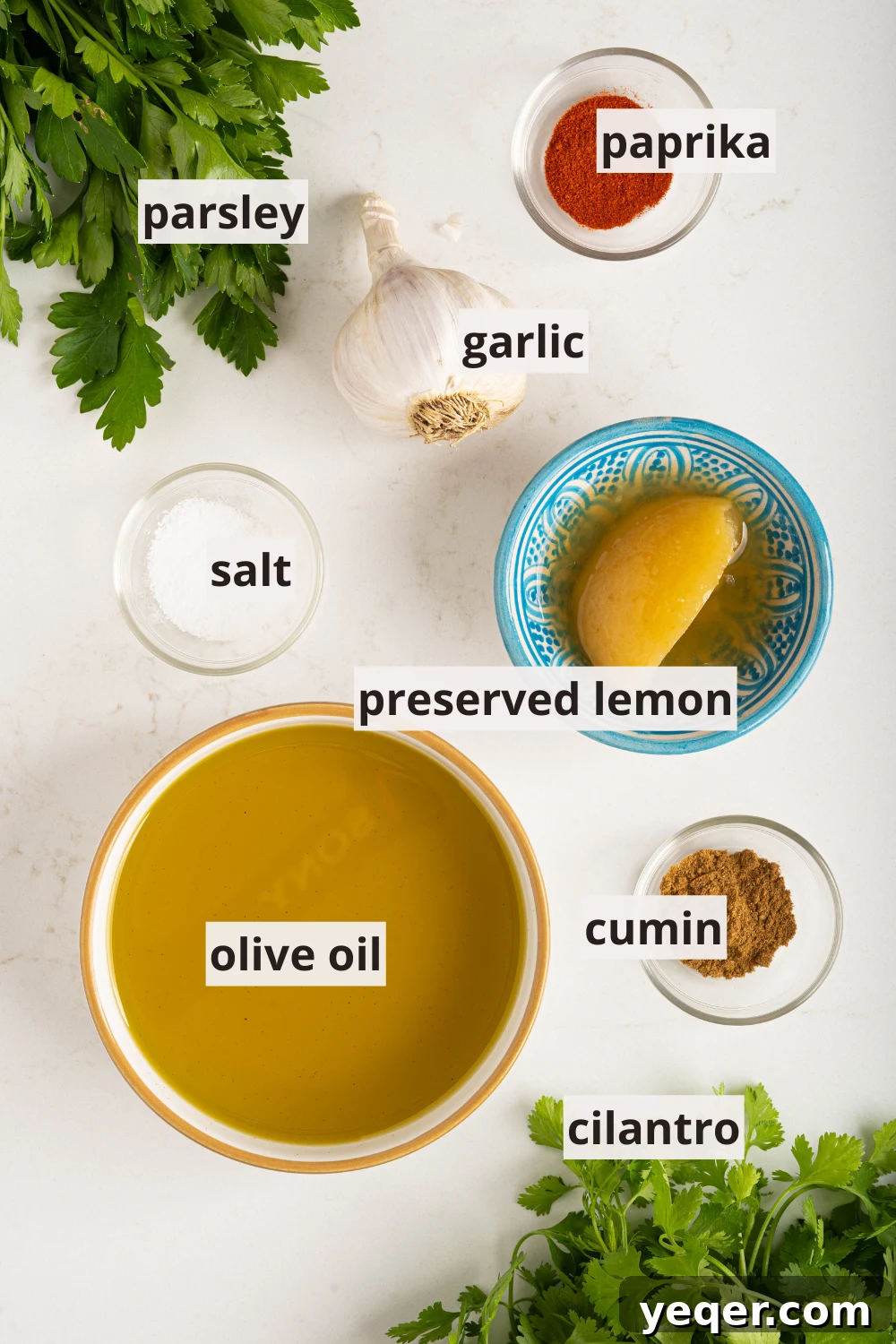 Individual bowls containing the fresh ingredients for chermoula: olive oil, preserved lemon, vibrant spices, and aromatic herbs.