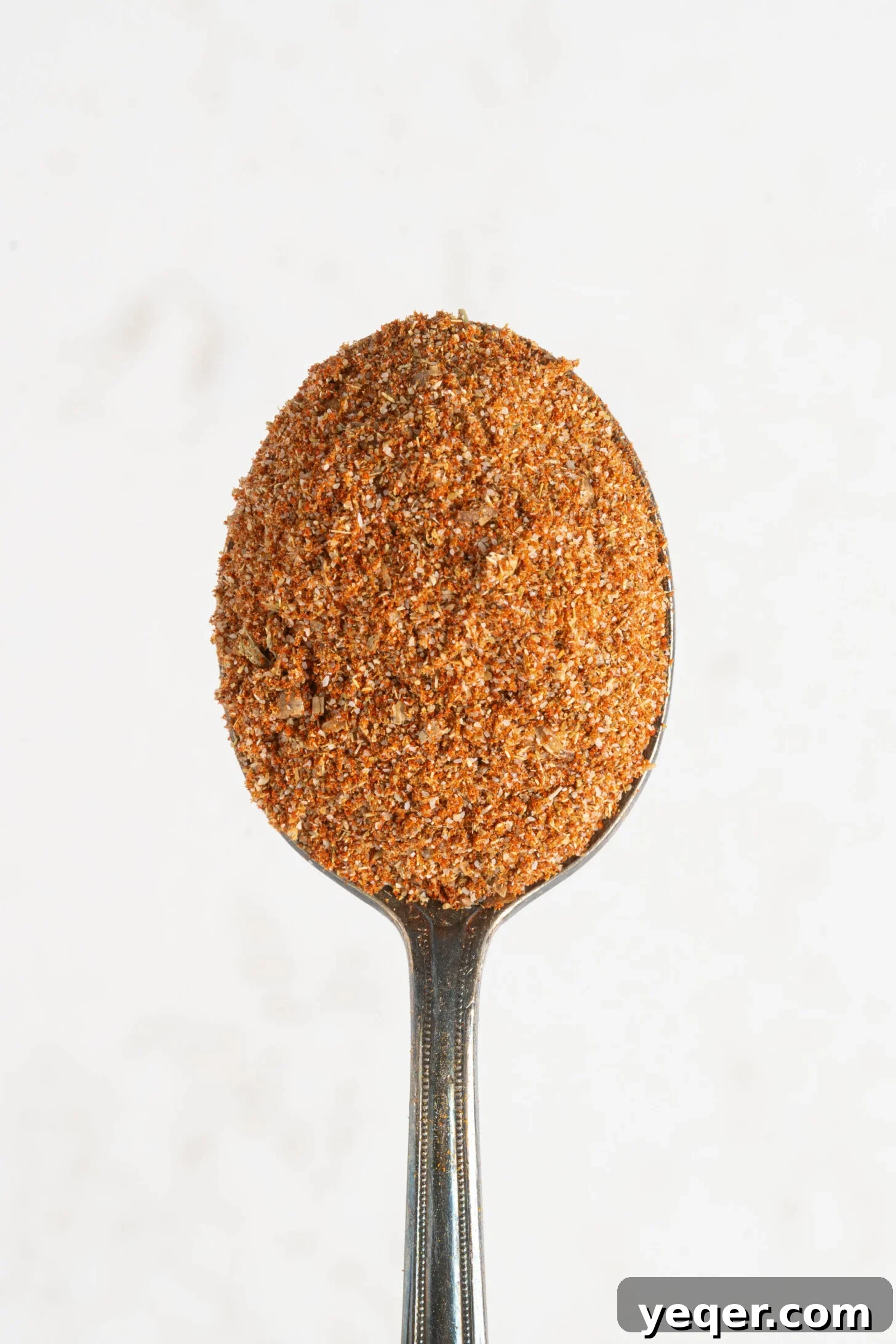 A spoonful of sazon seasoning.