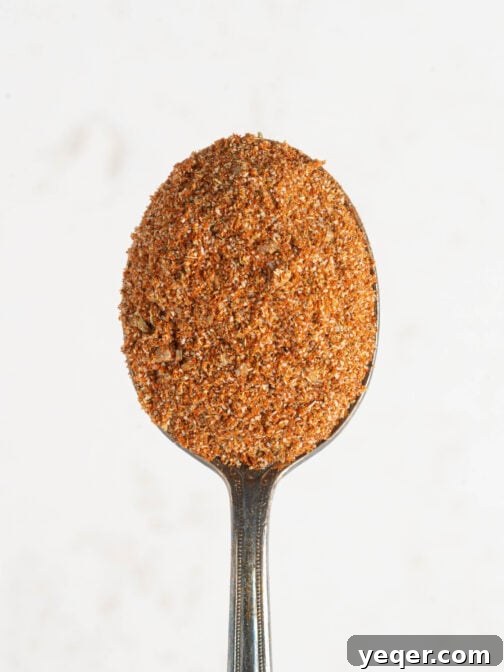 A spoonful of sazon seasoning.