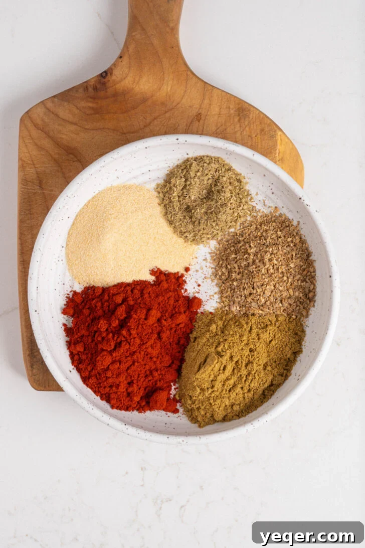 A bowl of sazon seasoning before being mixed.