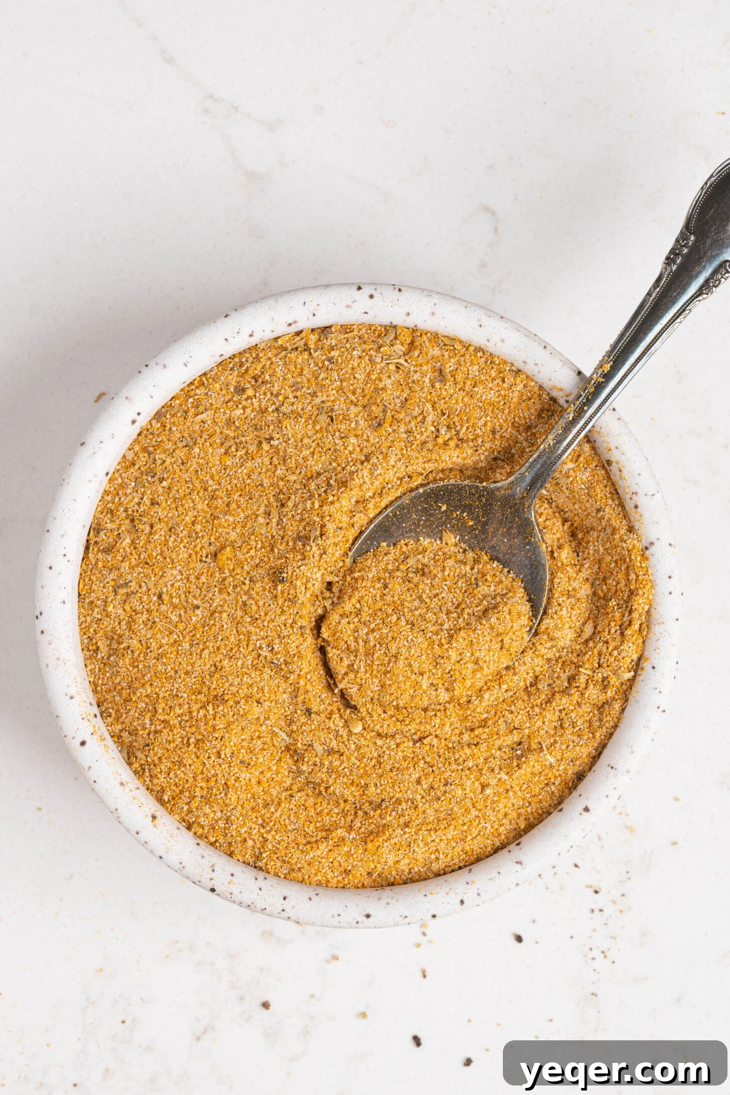 Your 5-Minute Homemade Adobo Spice Secret 4 Another perspective of a bowl of adobo seasoning, highlighting its rich color and texture.