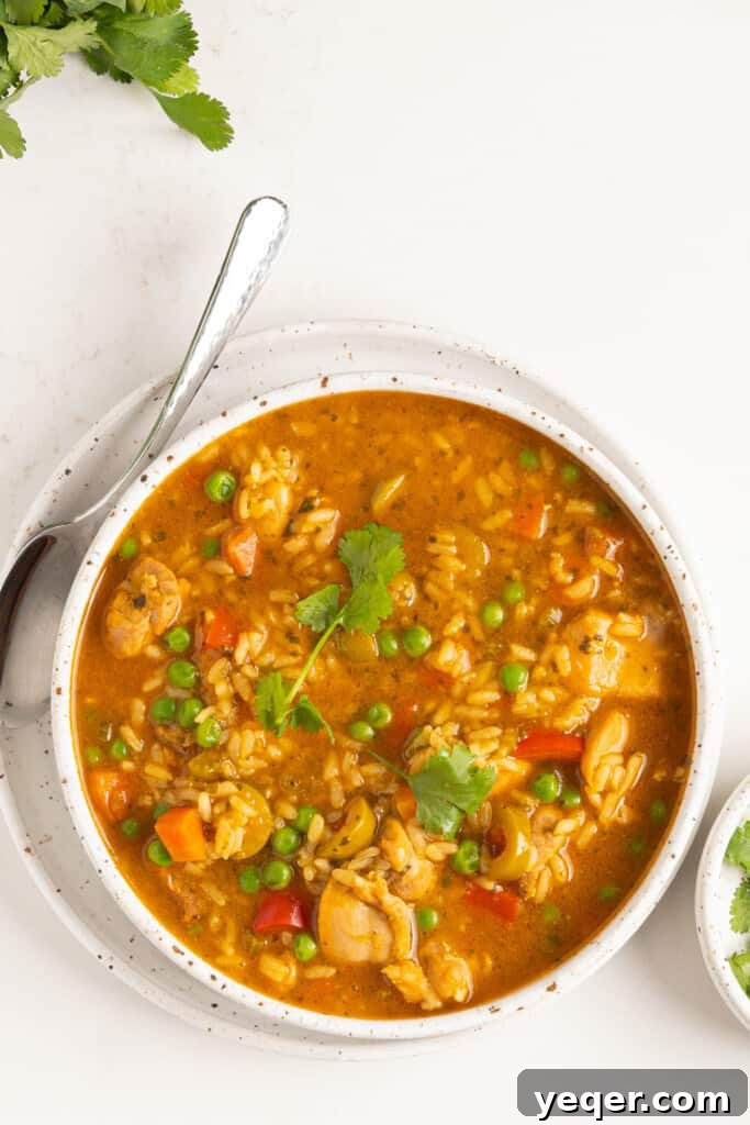 Asopao de Pollo Puerto Rico's Signature Chicken and Rice Stew 7 A finished bowl of Asopao de Pollo, garnished and ready to serve.