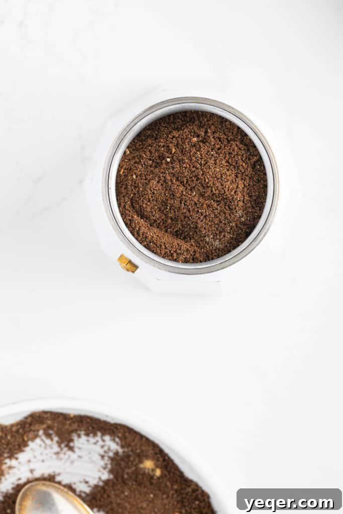 10 Minute Moroccan Coffee Bliss 6 Moroccan spiced coffee brewing in a drip coffee maker, with steam rising, indicating the brewing process.