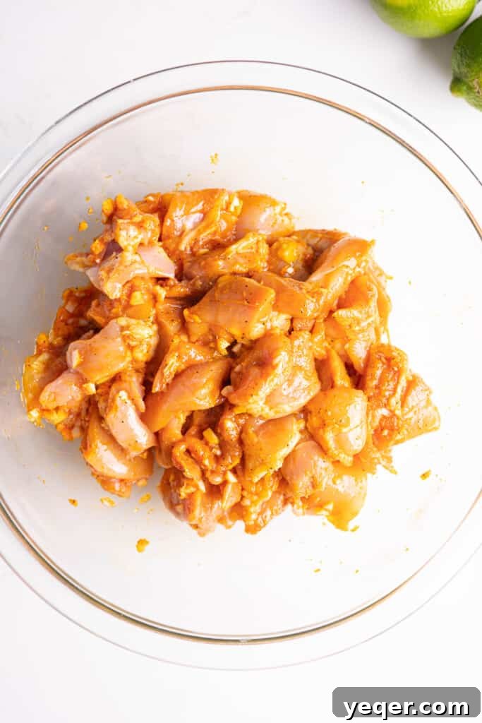 Golden Puerto Rican Chicken Chicharrones 4 A bowl of marinated chicken pieces