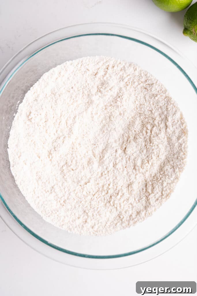 Golden Puerto Rican Chicken Chicharrones 5 A bowl of seasoned flour mixture