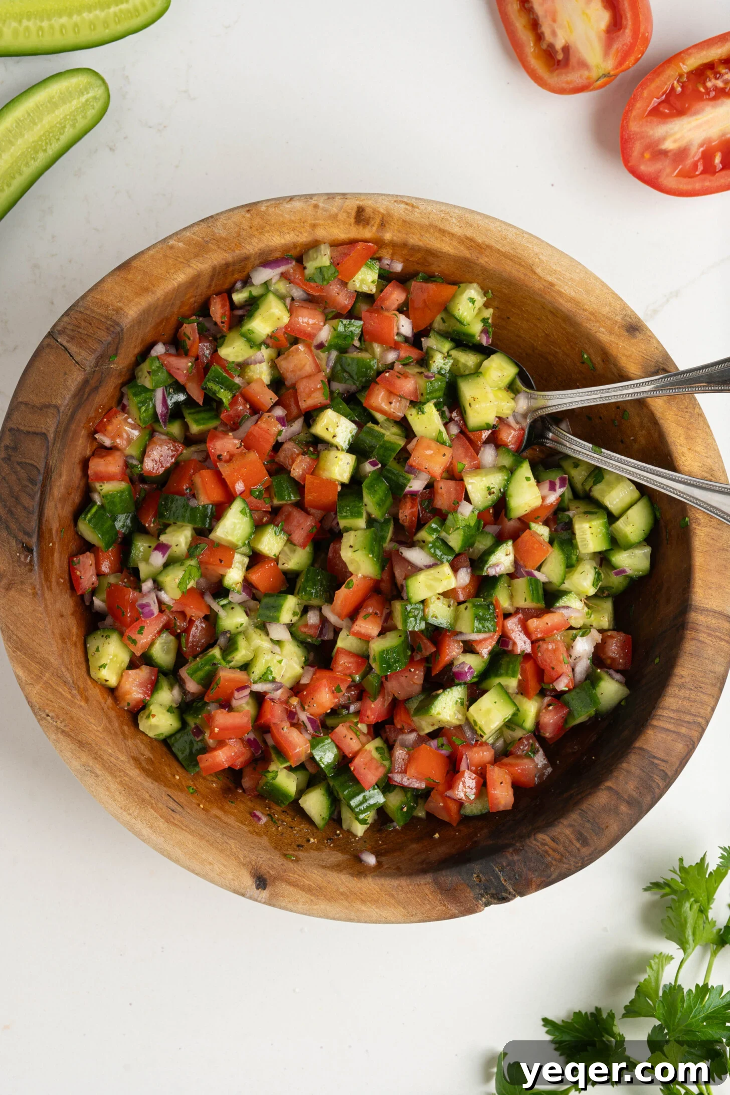 Vibrant Moroccan Cucumber Tomato Salad 3 Close-up of a freshly made Moroccan cucumber tomato salad, highlighting the perfectly diced vegetables and herbs.
