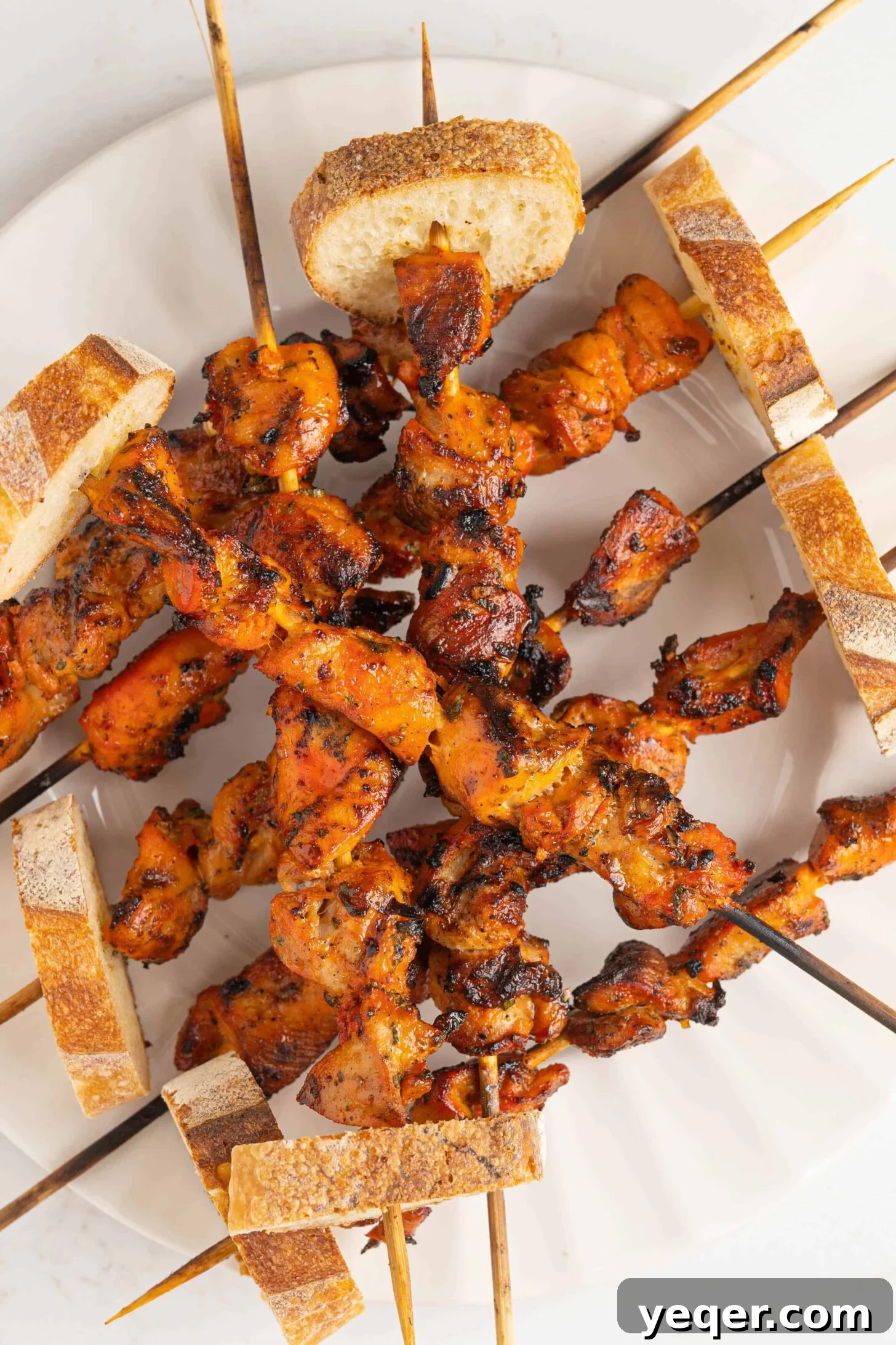 Zesty Grilled Puerto Rican Chicken Skewers 2 a plate of pinchos de pollo