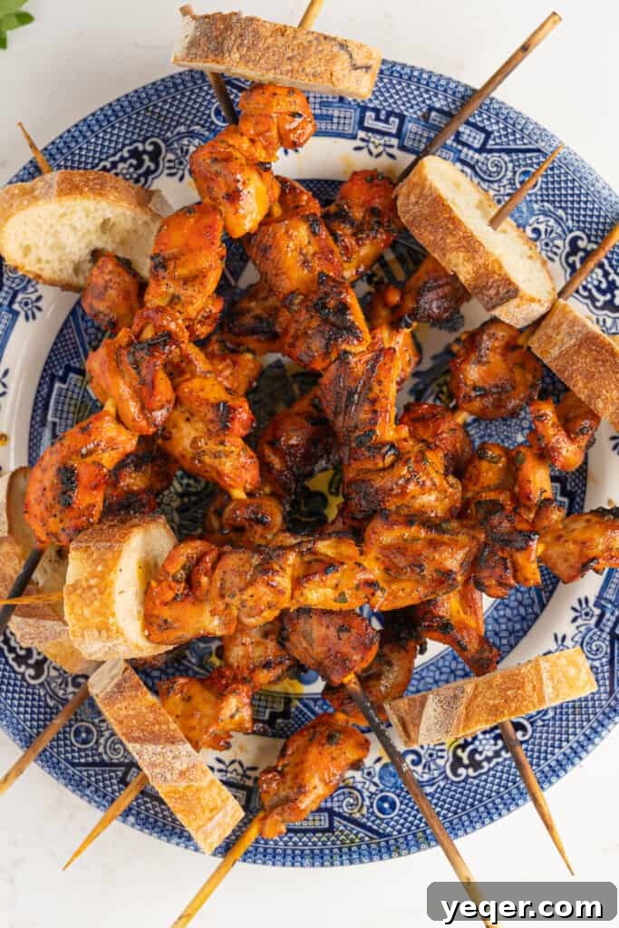 Zesty Grilled Puerto Rican Chicken Skewers 7 a plate of pinchos de pollo