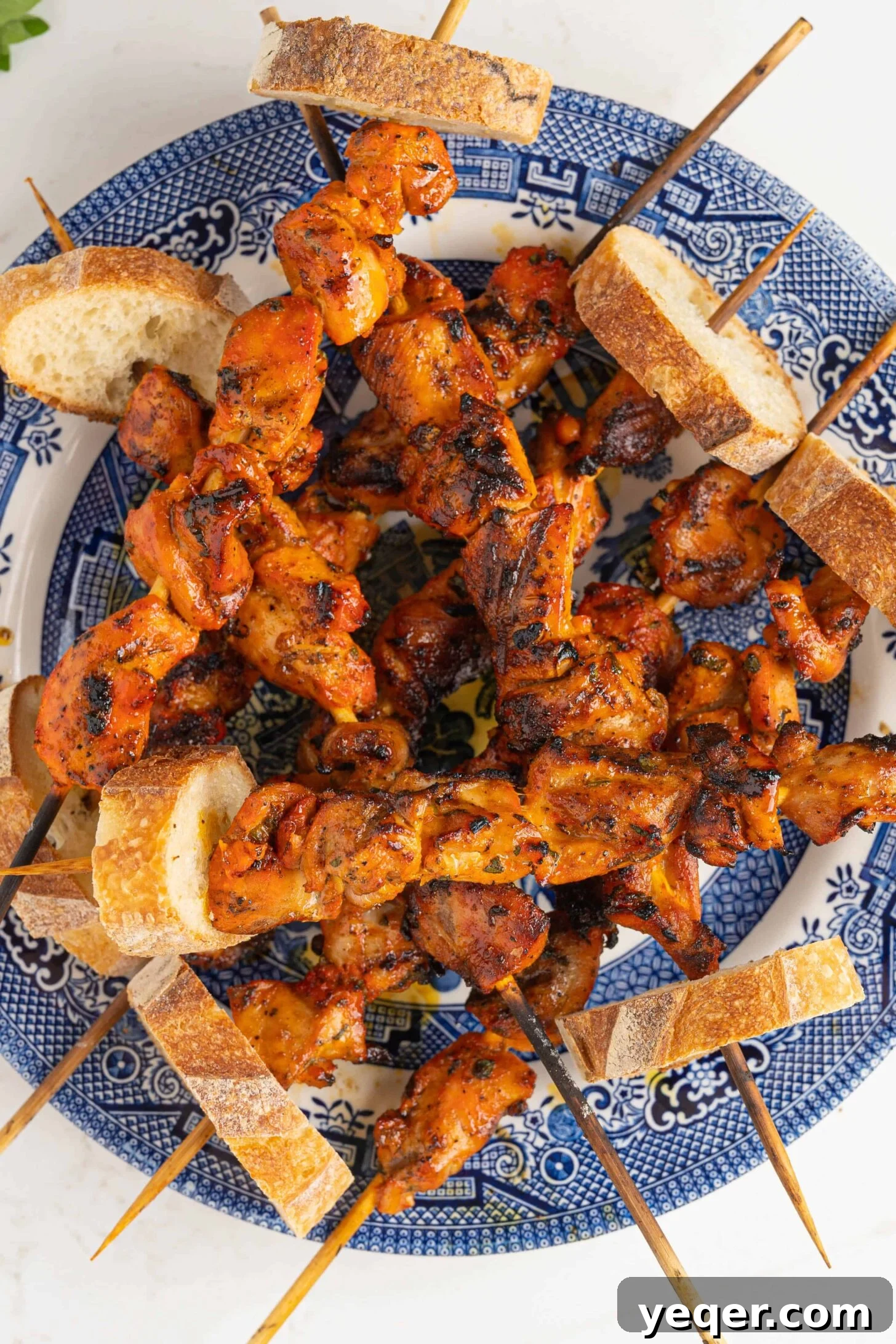 Zesty Grilled Puerto Rican Chicken Skewers 9 a plate of pinchos de pollo