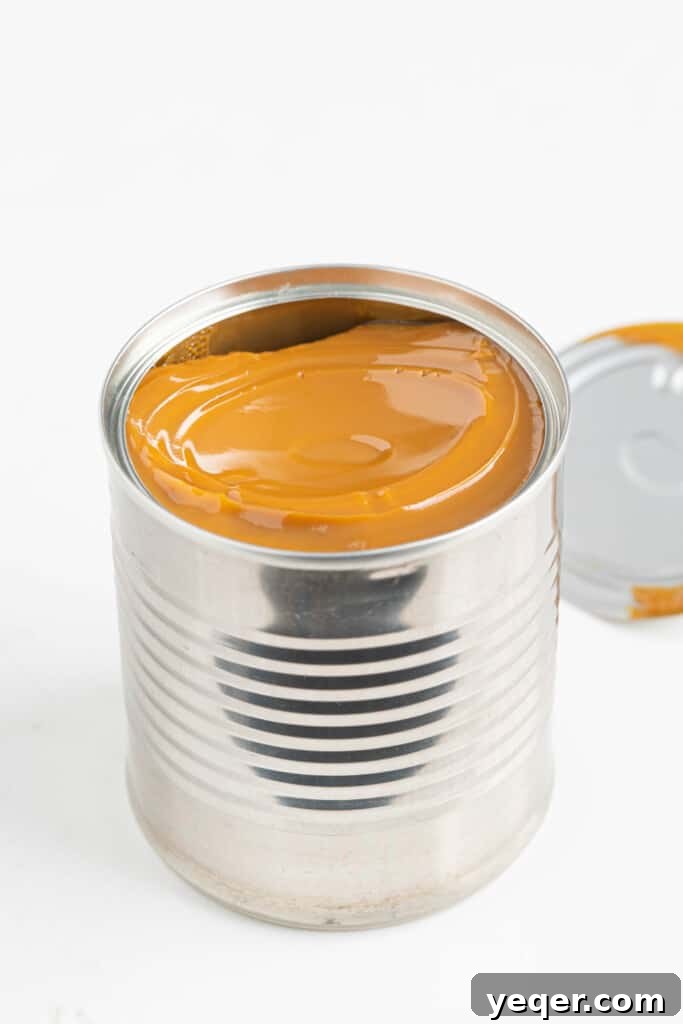 One Ingredient Wonder: Homemade Dulce de Leche Caramel Sauce 5 A freshly made jar of Dulce de Leche, displaying its creamy texture and deep caramel color.