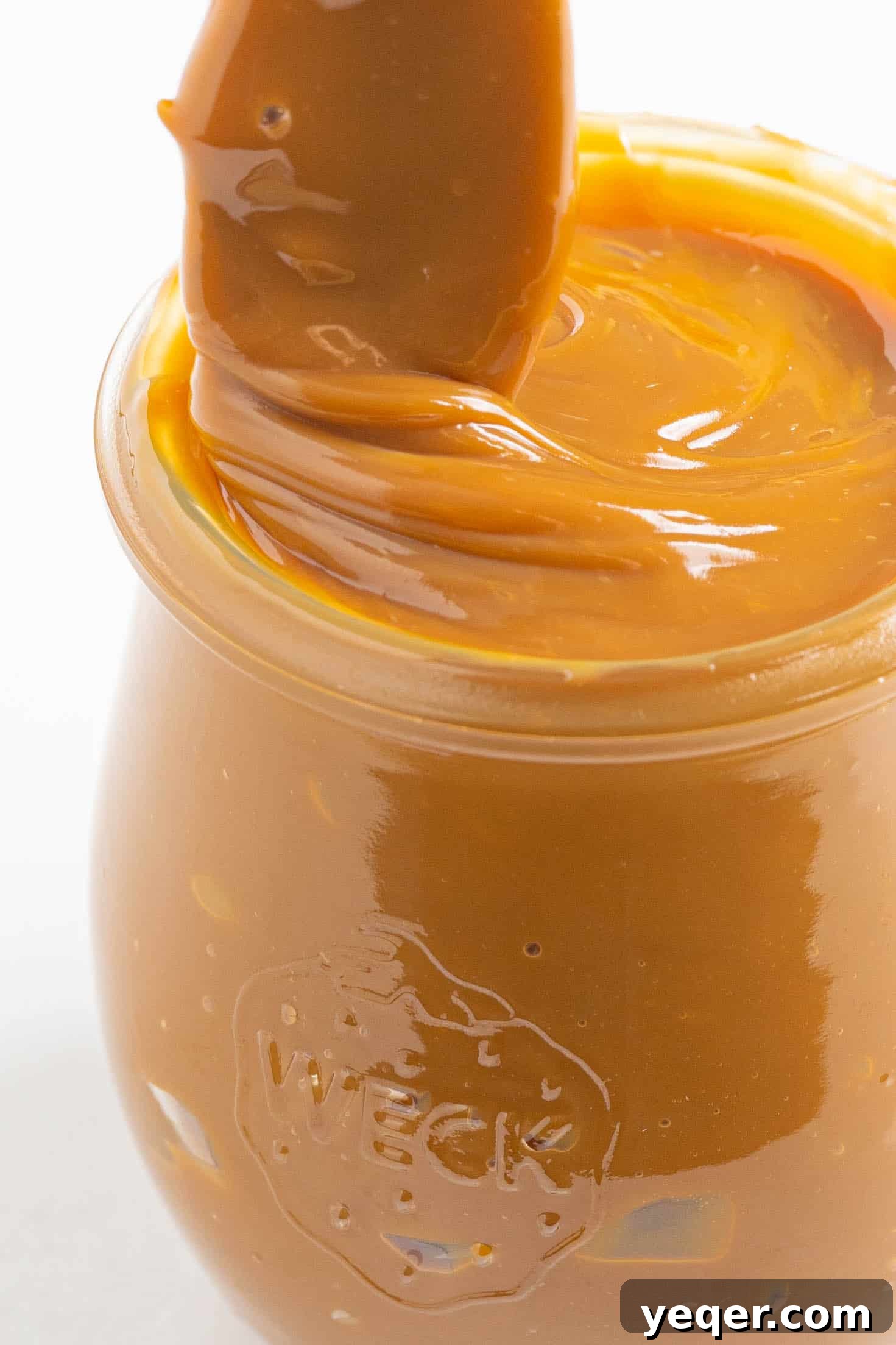 One Ingredient Wonder: Homemade Dulce de Leche Caramel Sauce 7 Another perspective of dulce de leche in a jar, showcasing its enticing richness.