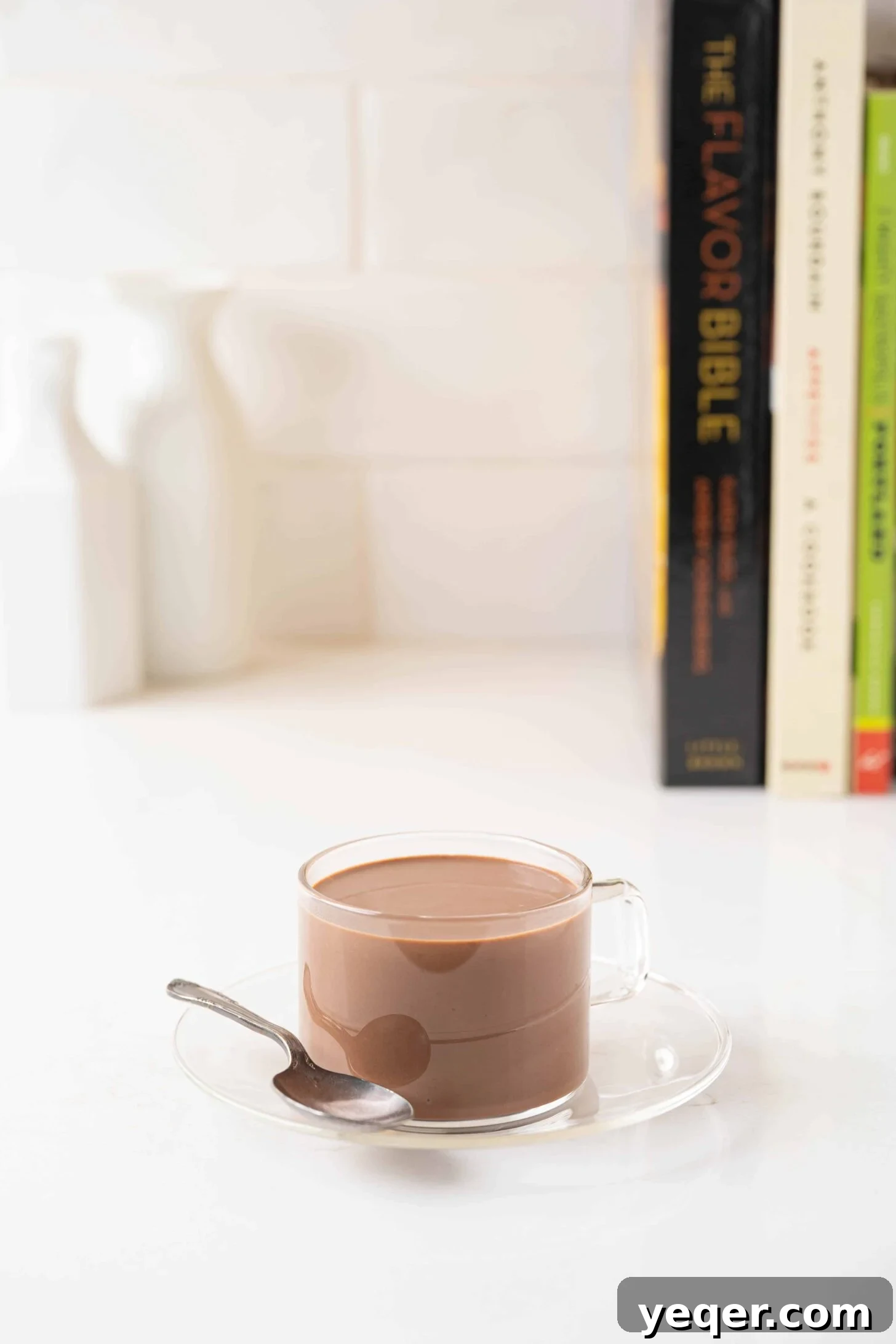 Velvety Spanish Cocoa Indulgence 2 A steaming cup of rich, thick Spanish hot chocolate, garnished with a sprinkle of cocoa powder, inviting a cozy experience