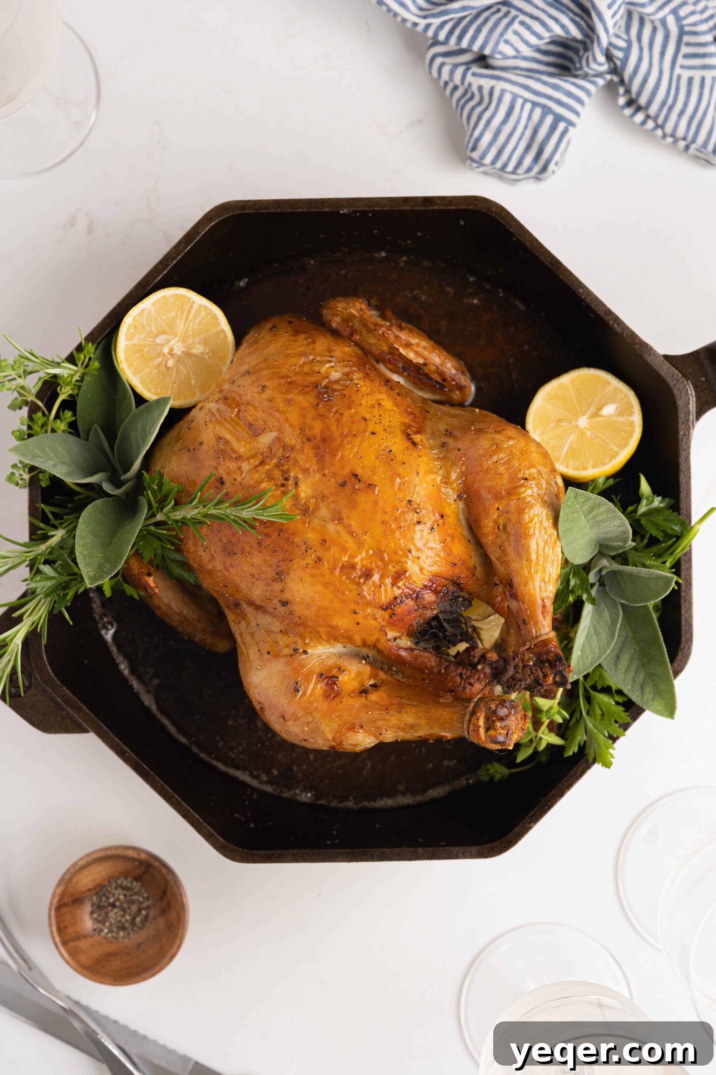 Succulent Golden Roast Chicken 2 A beautifully roasted whole chicken resting in a cast iron pan, ready to be carved.