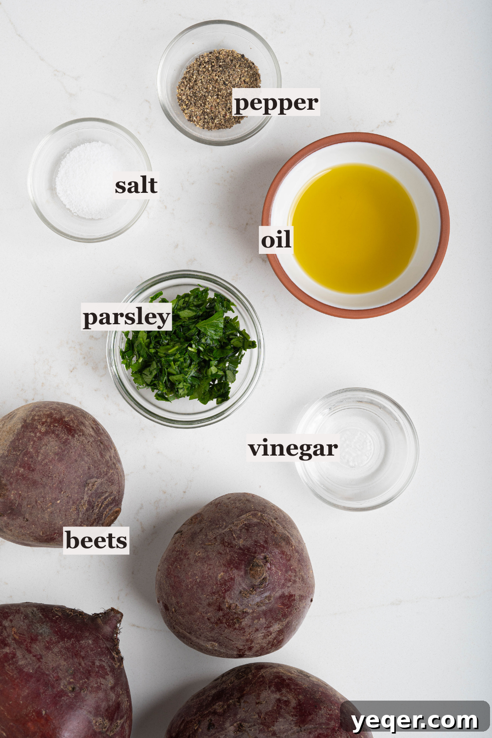 Chilled Moroccan Roasted Beet Salad 3 A collection of small bowls holding key ingredients like olive oil, salt, vinegar, and fresh herbs, ready for salad preparation.