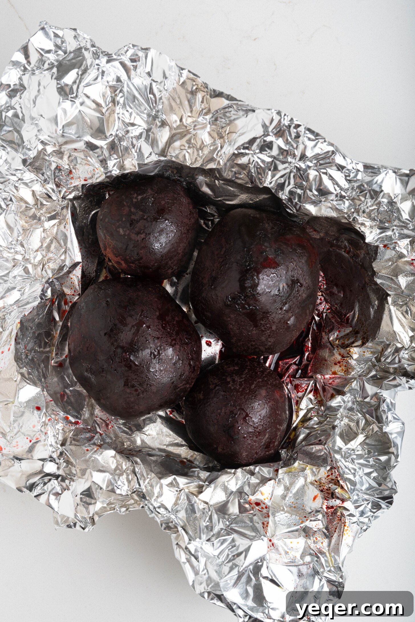 Chilled Moroccan Roasted Beet Salad 6 Roasted beets cooling down inside their aluminum foil wrapping.