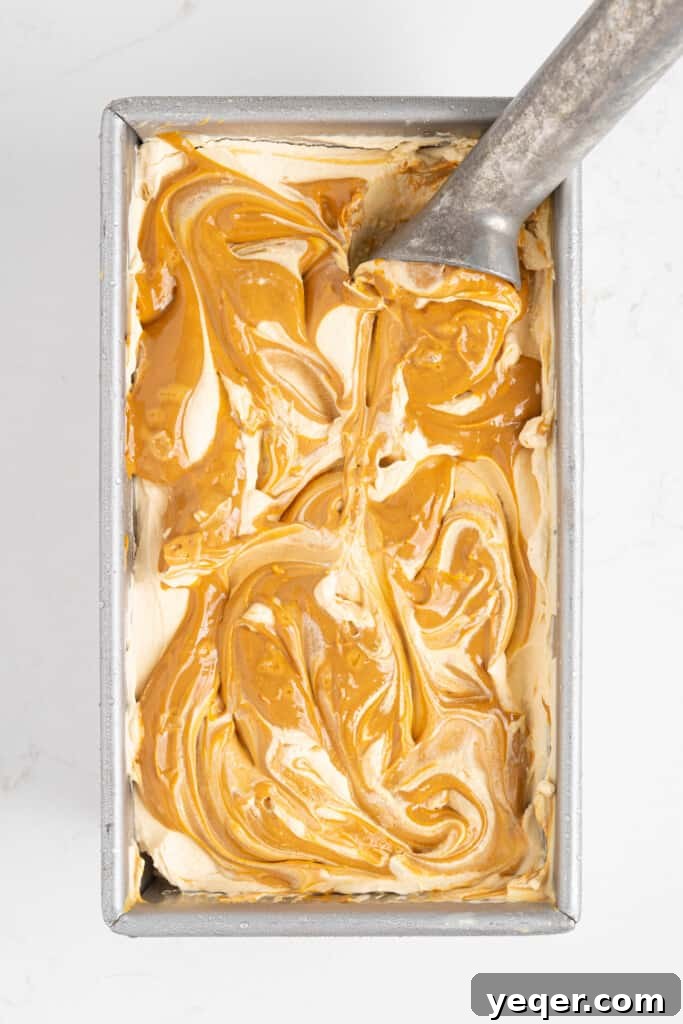 Three-Ingredient Bliss: Dulce de Leche Ice Cream 8 The dulce de leche ice cream fully frozen and ready to be served from the pan