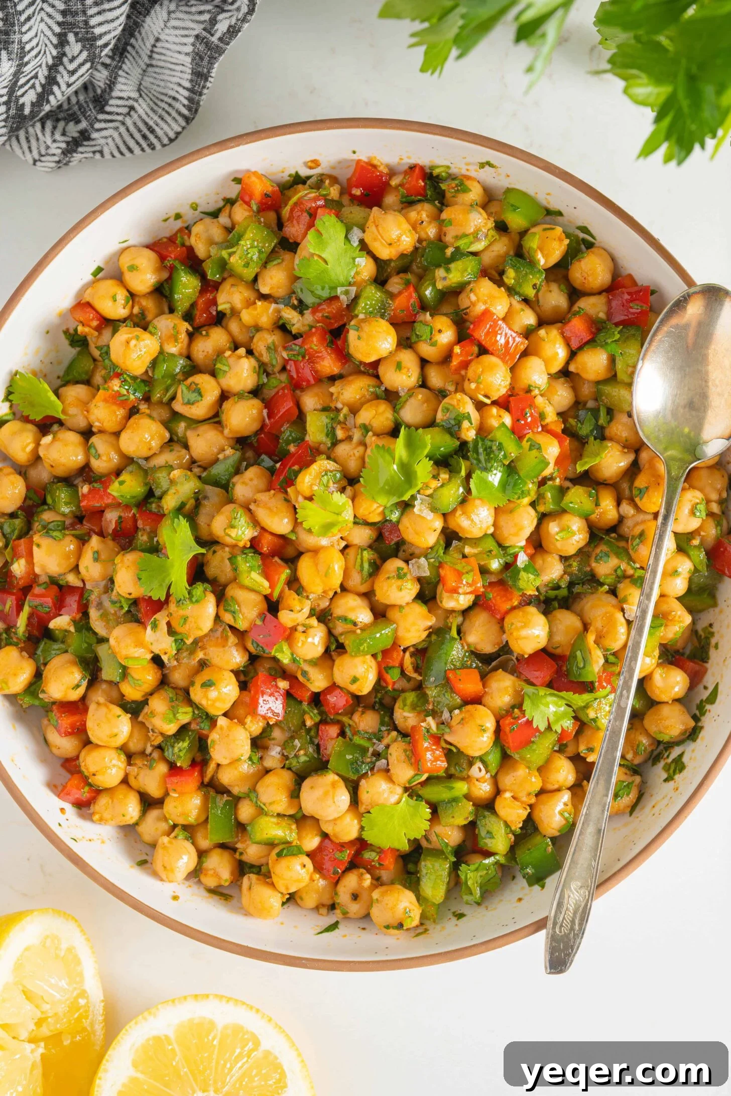 Vibrant 15-Minute Moroccan Chickpea Salad 8 A closer view of the spiced chickpea salad in a bowl, showing the texture of chickpeas, bell peppers, and herbs.