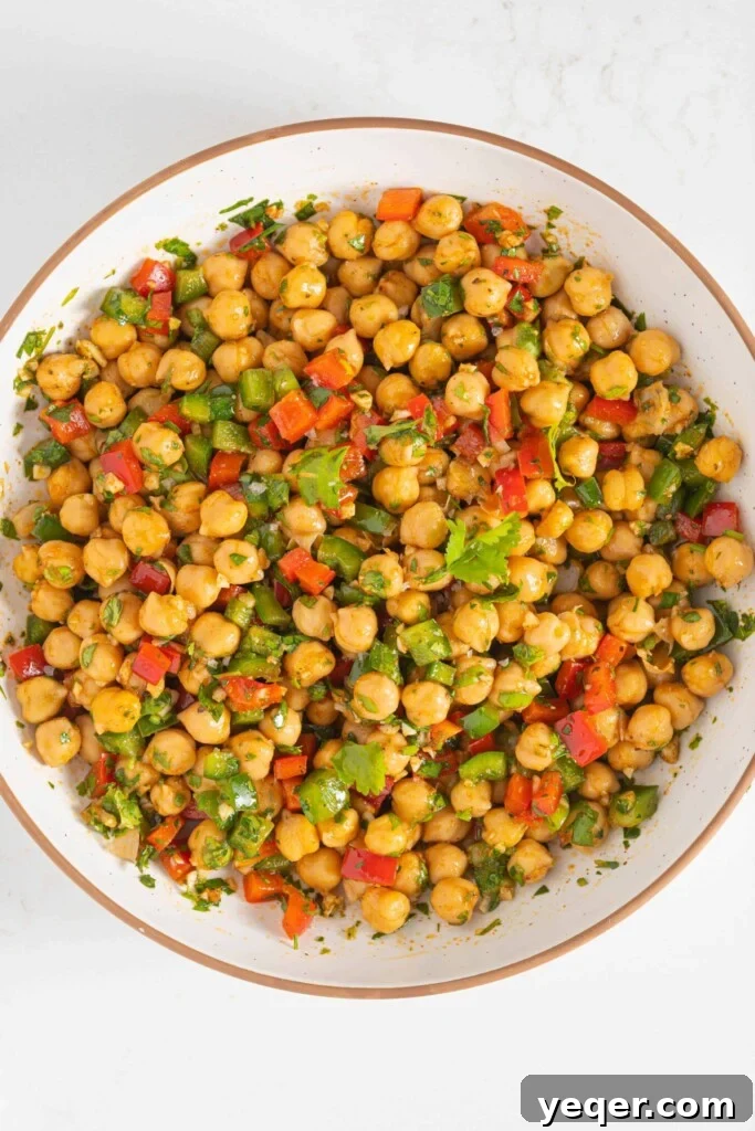 Vibrant 15-Minute Moroccan Chickpea Salad 6 A vibrant bowl of spiced chickpea salad fully mixed and ready to be enjoyed.