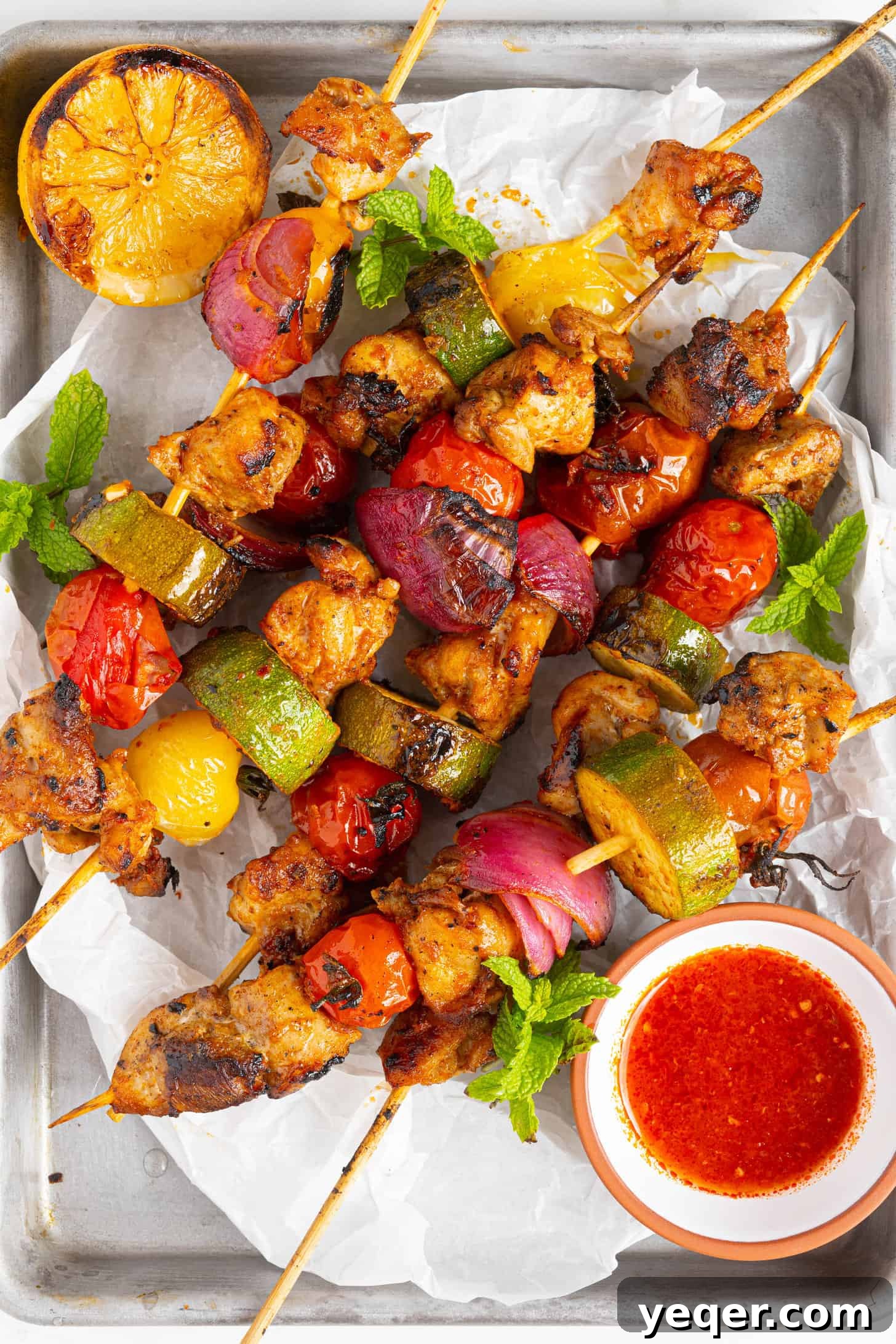 Flavor-Packed Harissa Chicken Skewers in 30 Minutes 11 harissa chicken skewers sizzling on a pan, close up