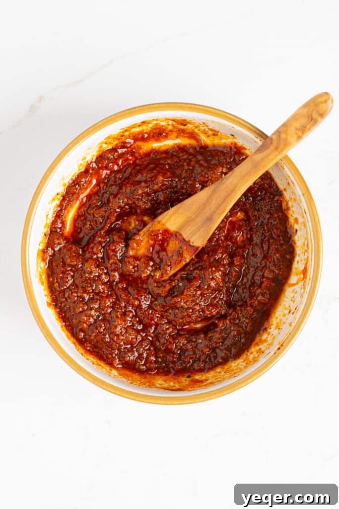 Flavor-Packed Harissa Chicken Skewers in 30 Minutes 5 a small bowl of harissa marinade